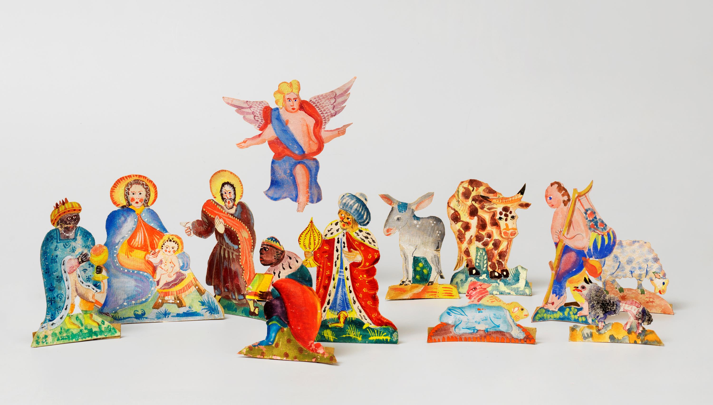 mehrere Krippenfiguren aus Papier in bunten fröhlichen Farben